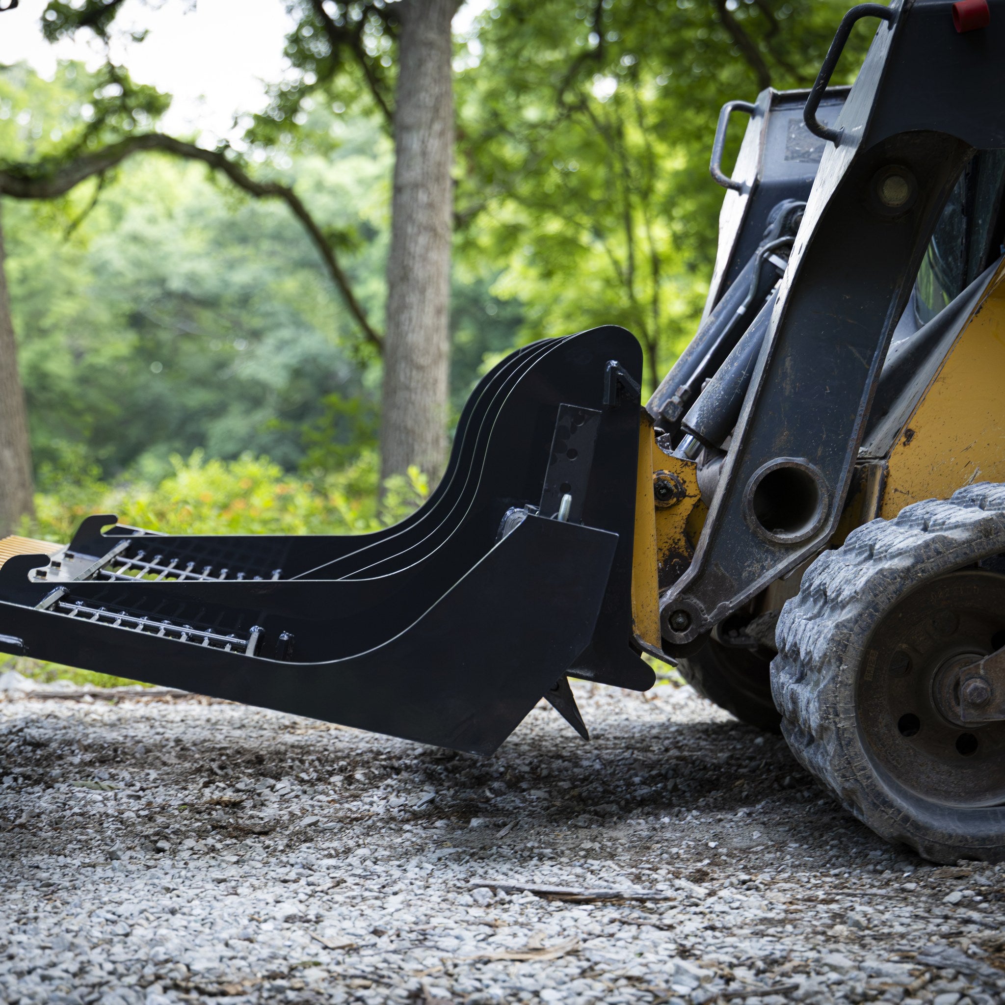 Replaceable scarifier teeth underneath the land planer