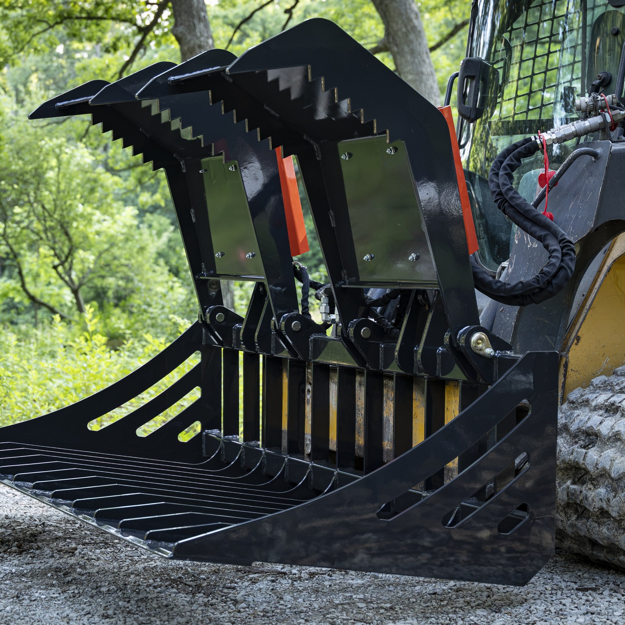 Mammoth rock grapple mounted on compact track loader