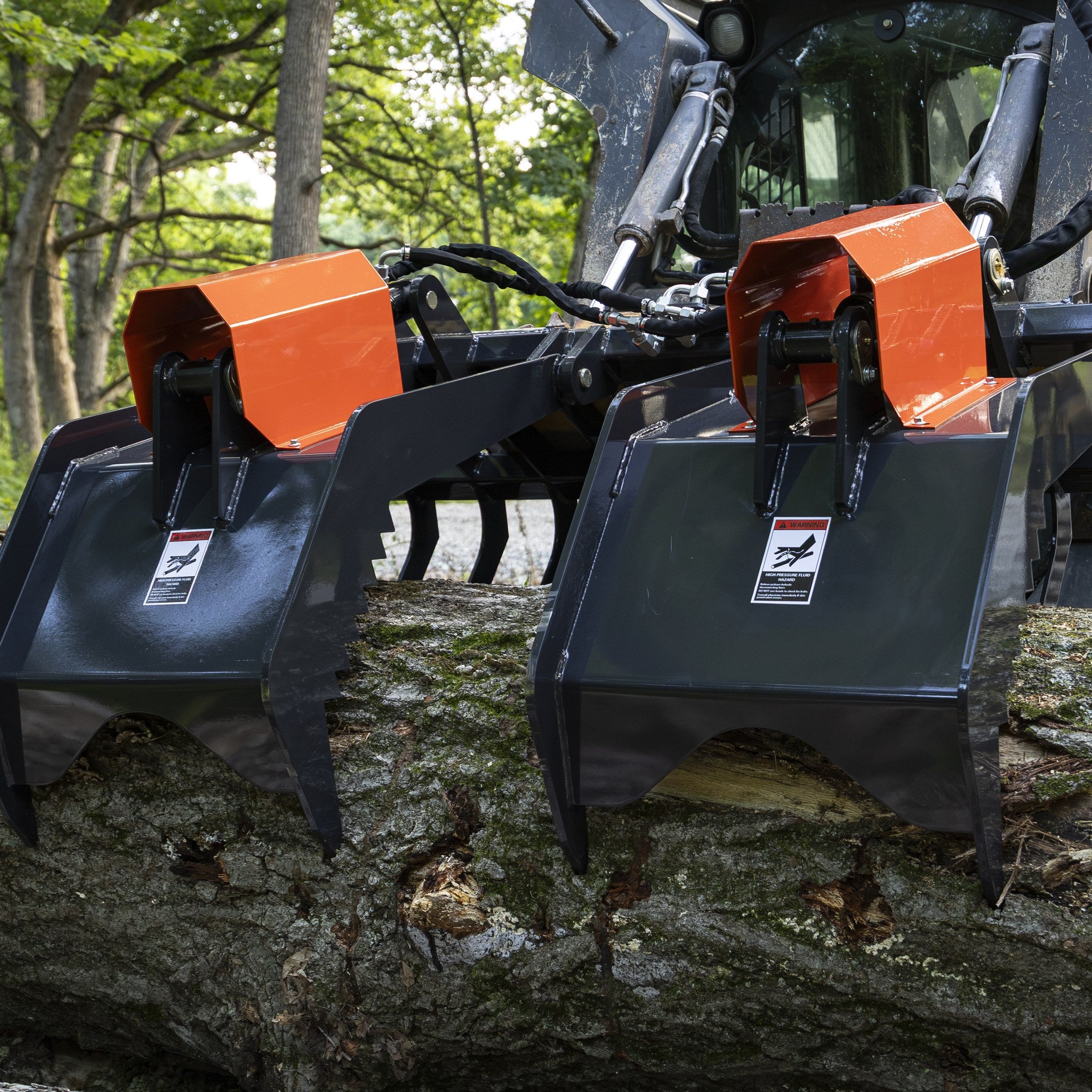 Rock grapple clamping a log