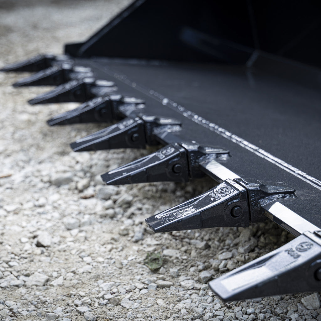 Close up of bolt on replaceable bucket teeth