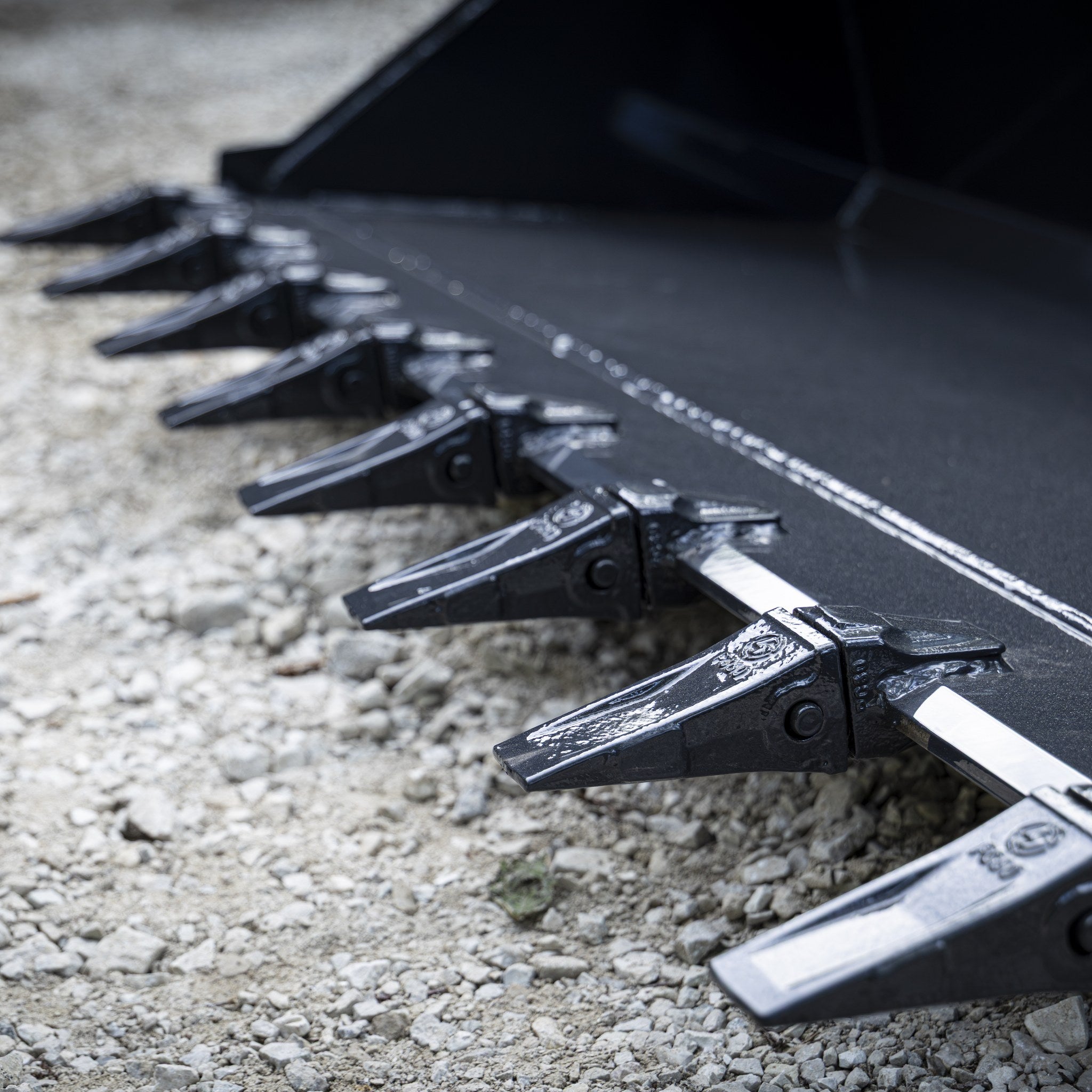Close up of bolt on replaceable bucket teeth