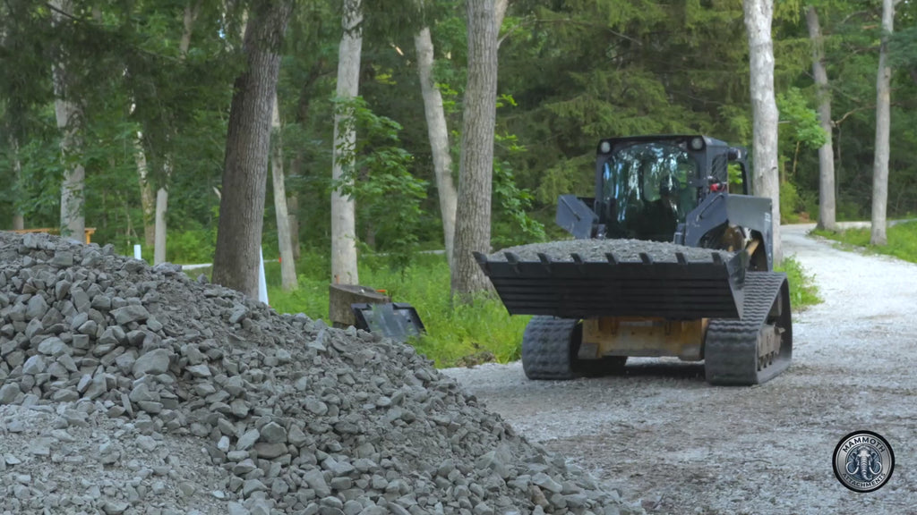 Mammoth 72 inch tooth bucket digging and carrying a loaded bucket